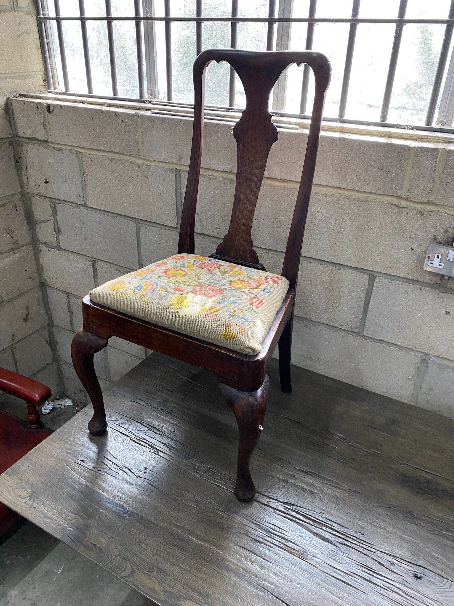 A pair of 18th century oak and walnut dining chairs